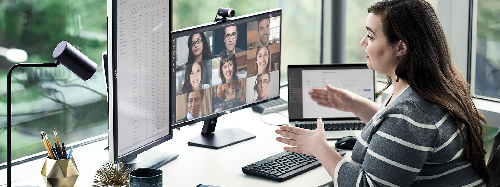 a person speaking to an audience through a virtual video conference.