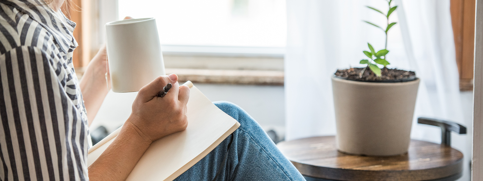 A young woman taking a break from technology and writing.