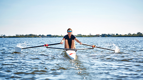 Anna rowing in a racing shell in the altantic ocean