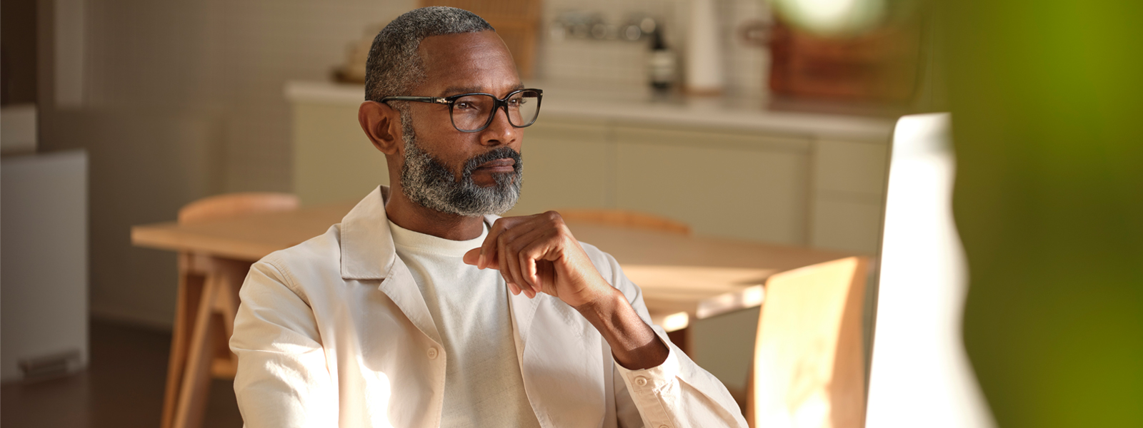 A man in glasses brainstorming dinner ideas.