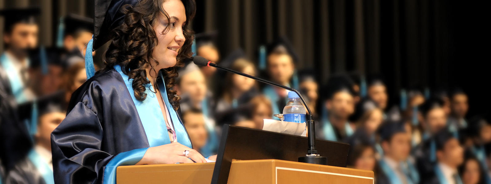 A graduating student giving a graduation speech.