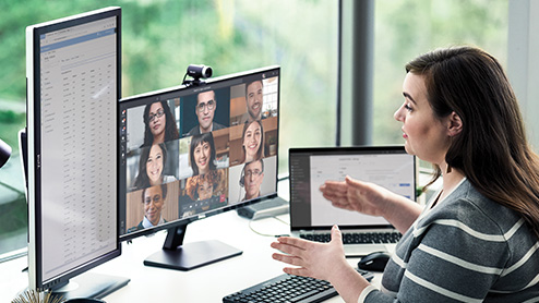 a person speaking to an audience through a virtual video conference.