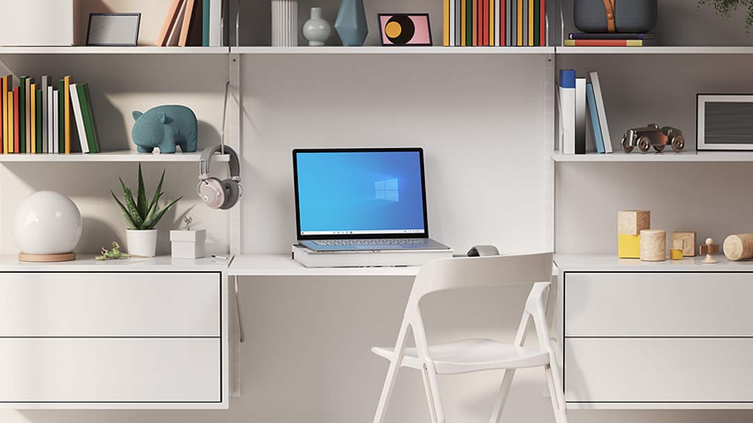 an office desk with a laptop and chair